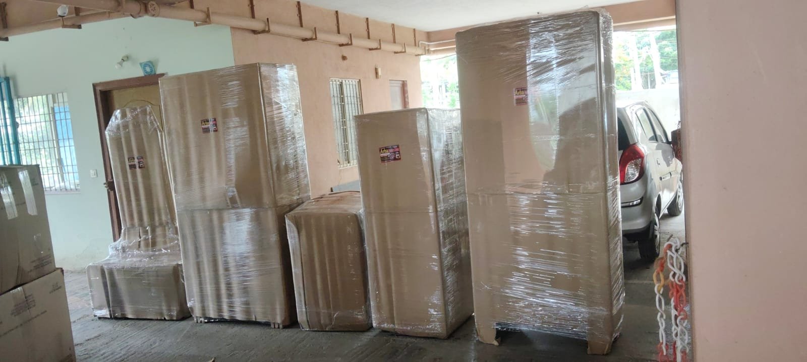 Large household furniture wrapped and ready for shifting