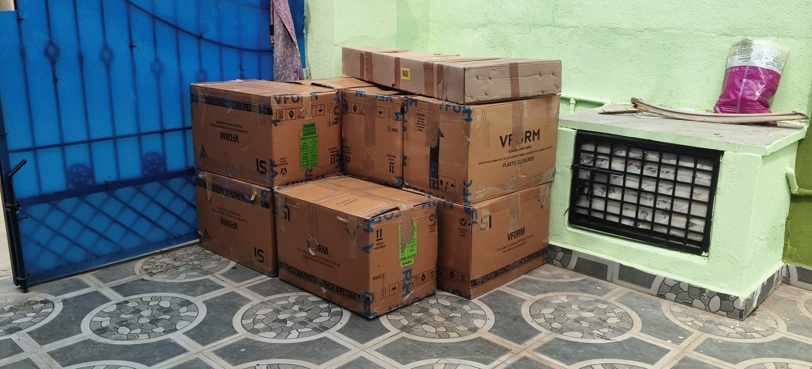 Sealed cartons stacked for household shifting