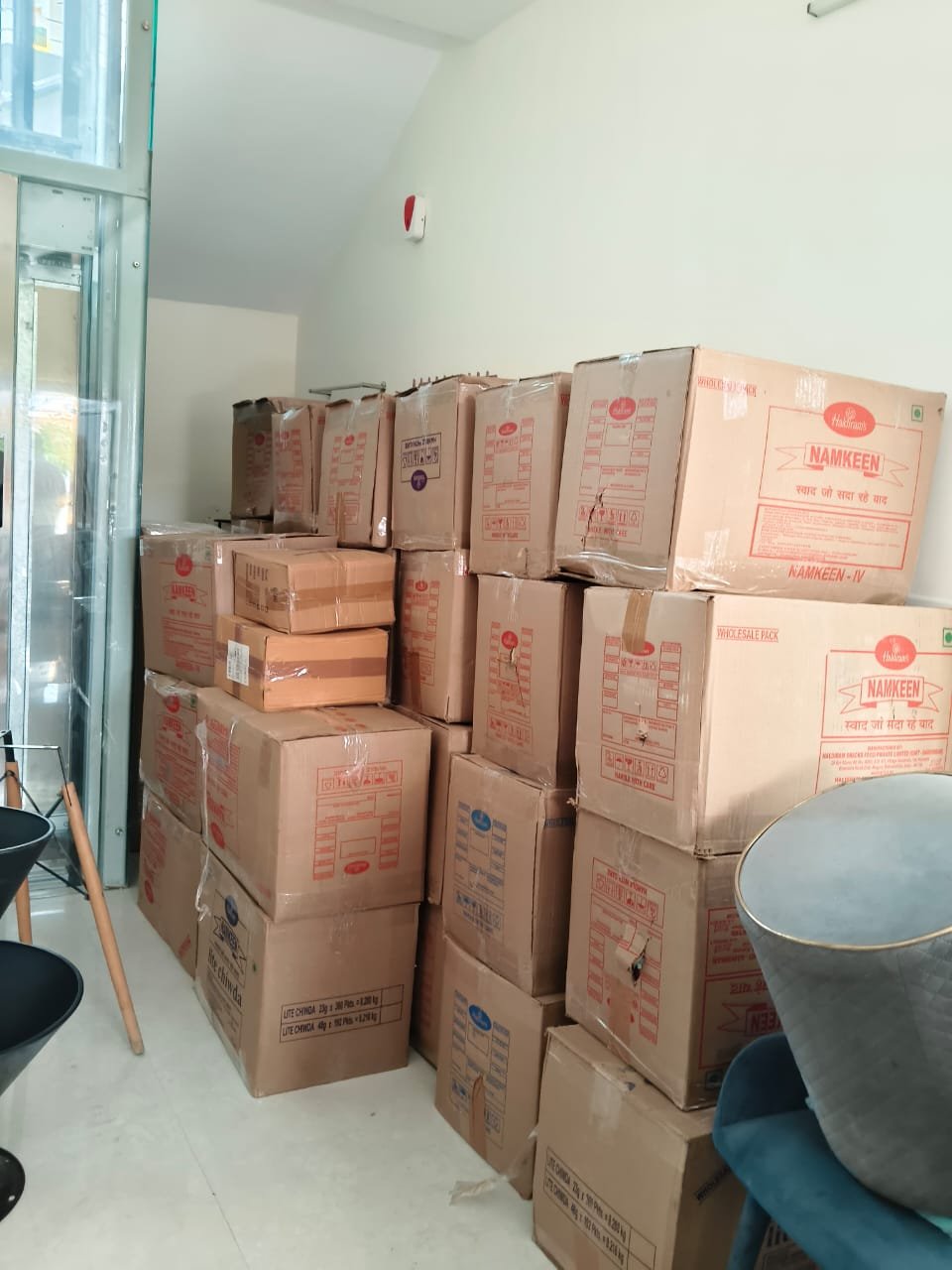Many cartons packed and stacked indoors