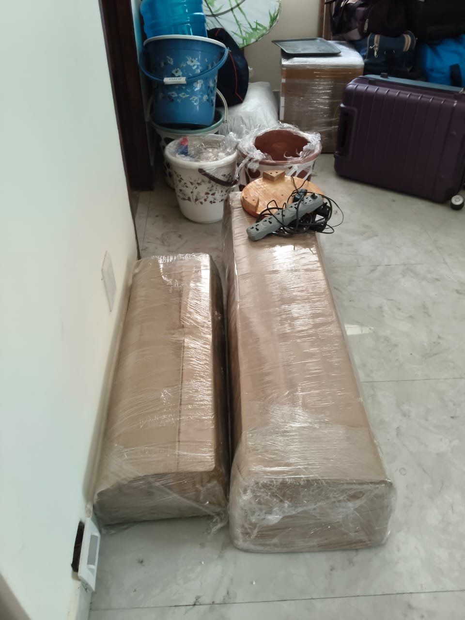 Household goods and boxes wrapped for relocation