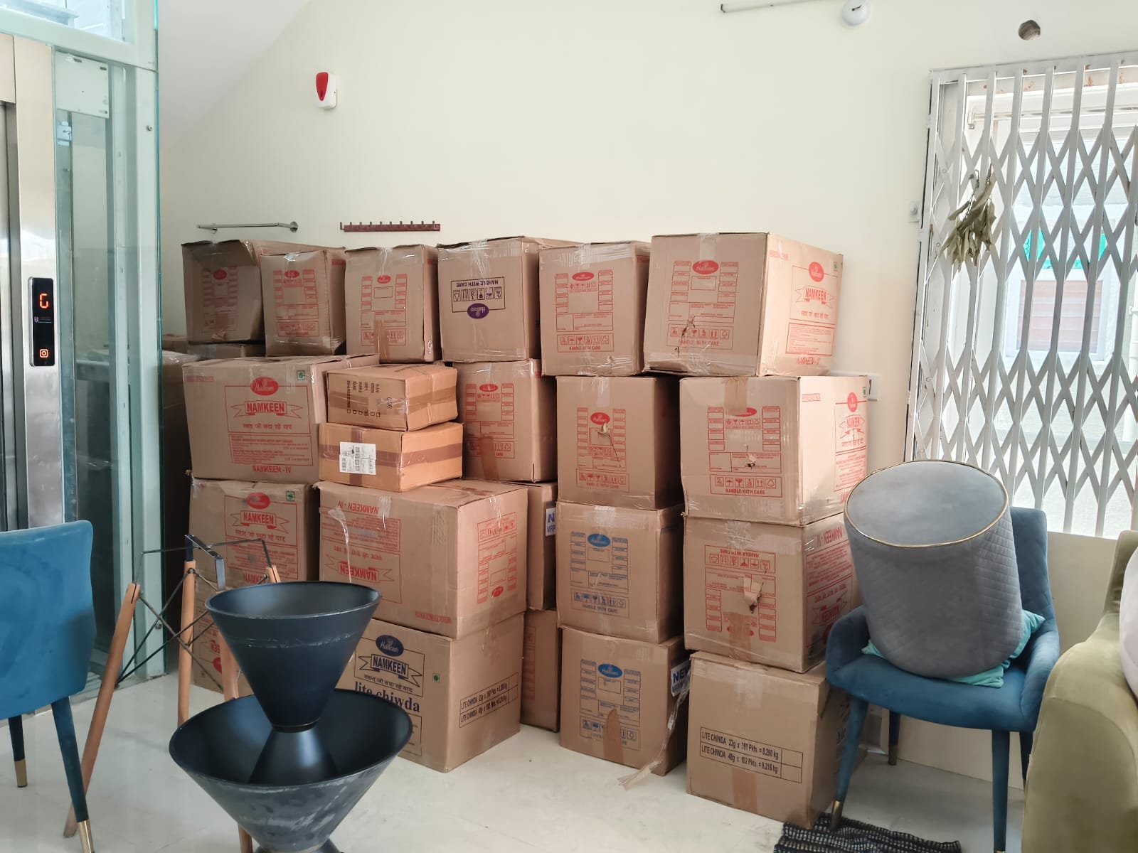 Cartons stacked neatly beside furniture before moving