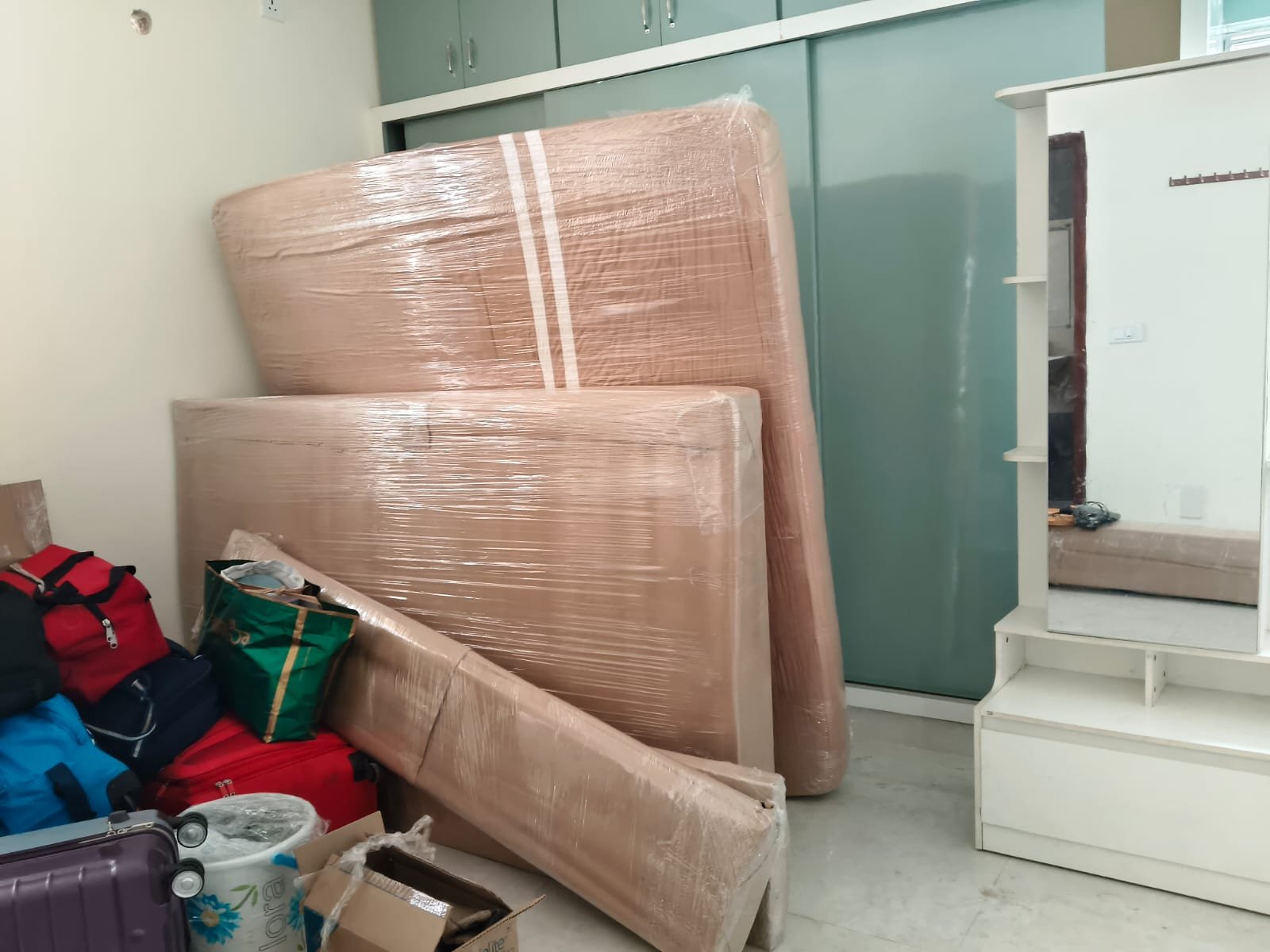 Mattress and long furniture wrapped with protective film