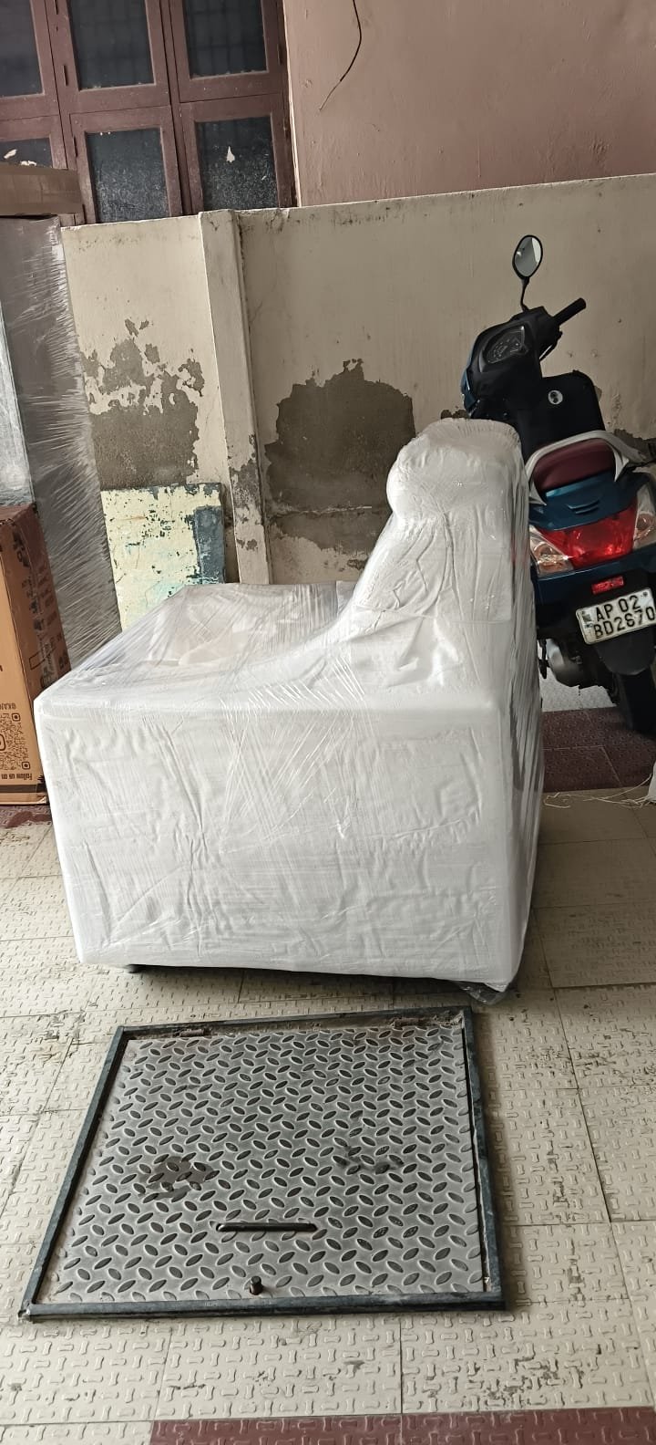 Chair wrapped in white protective covering
