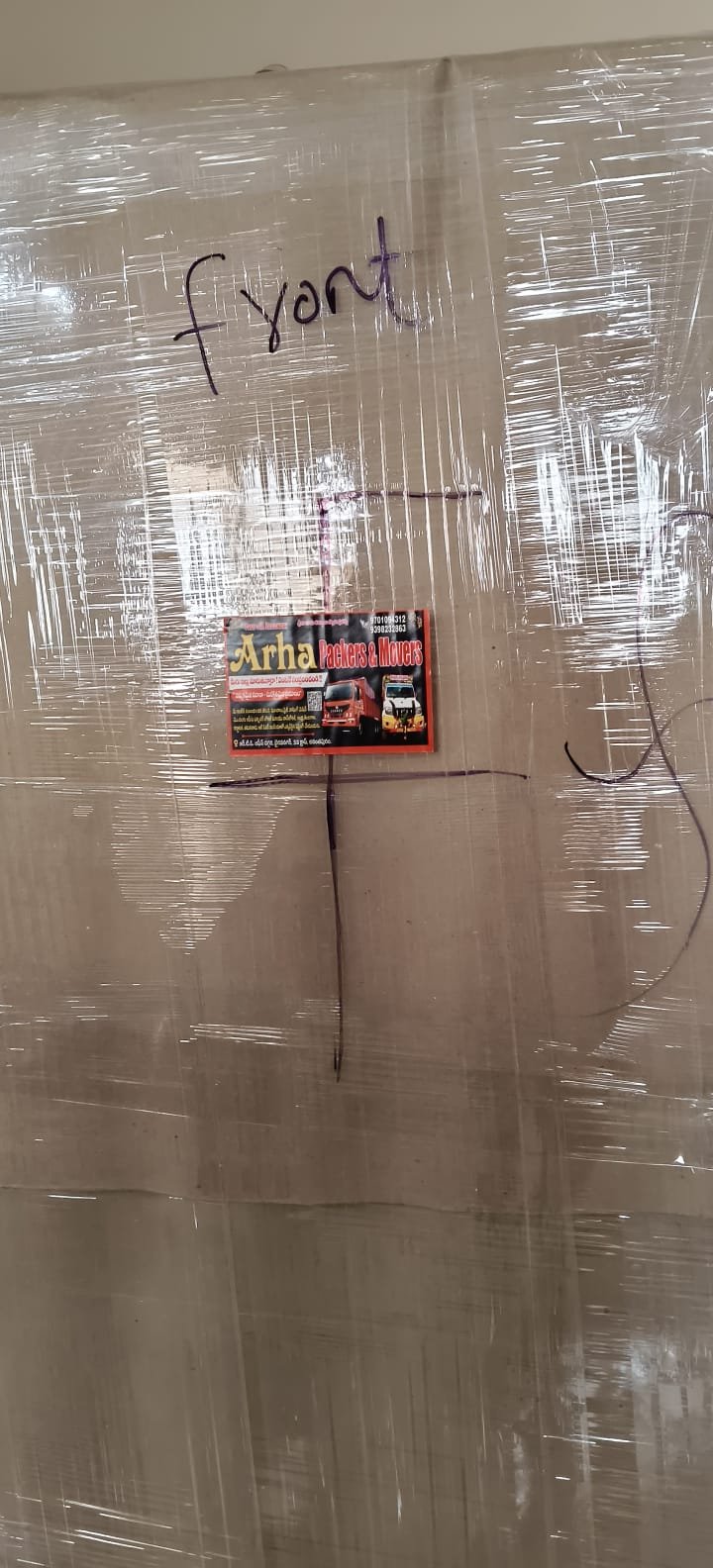 Close view of a wrapped carton marked front