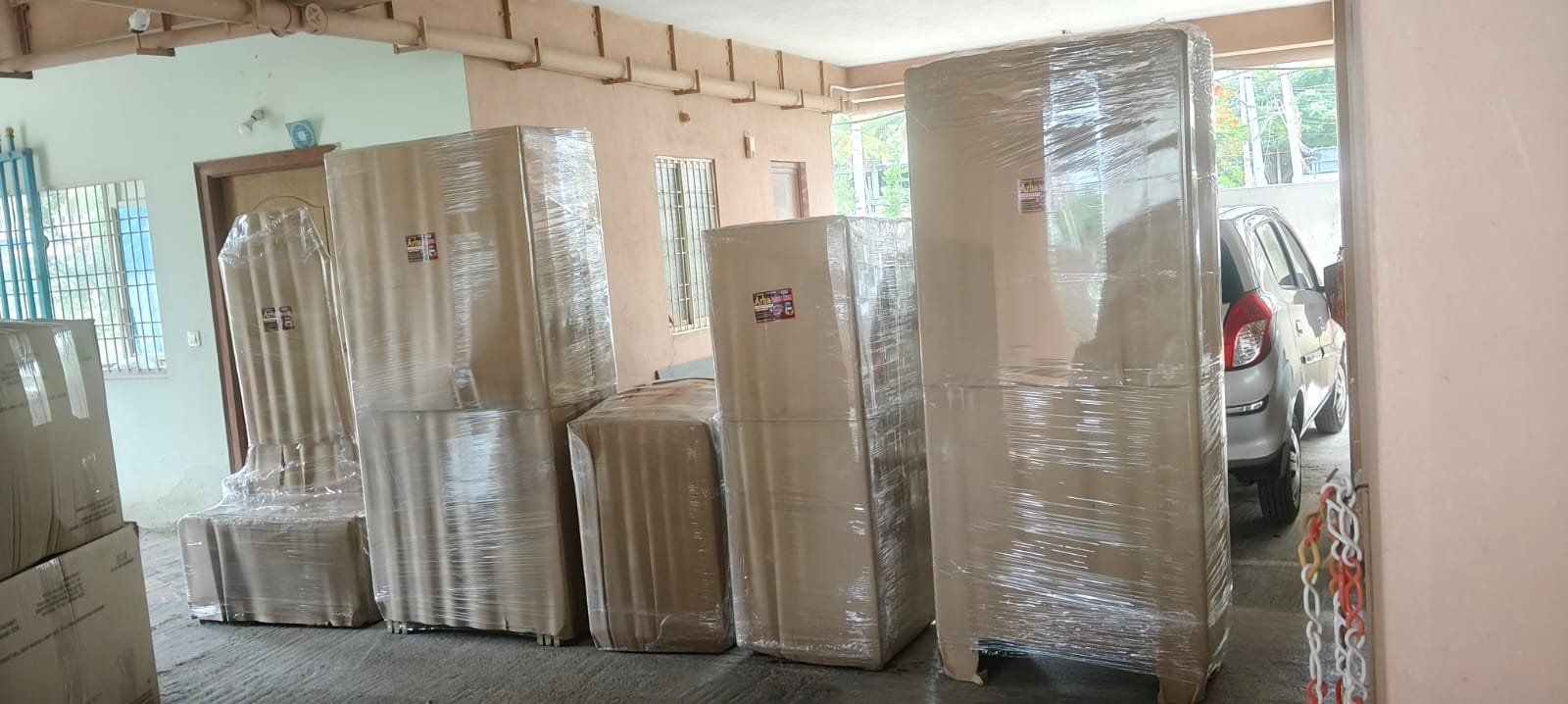 Furniture and household items wrapped near parking area