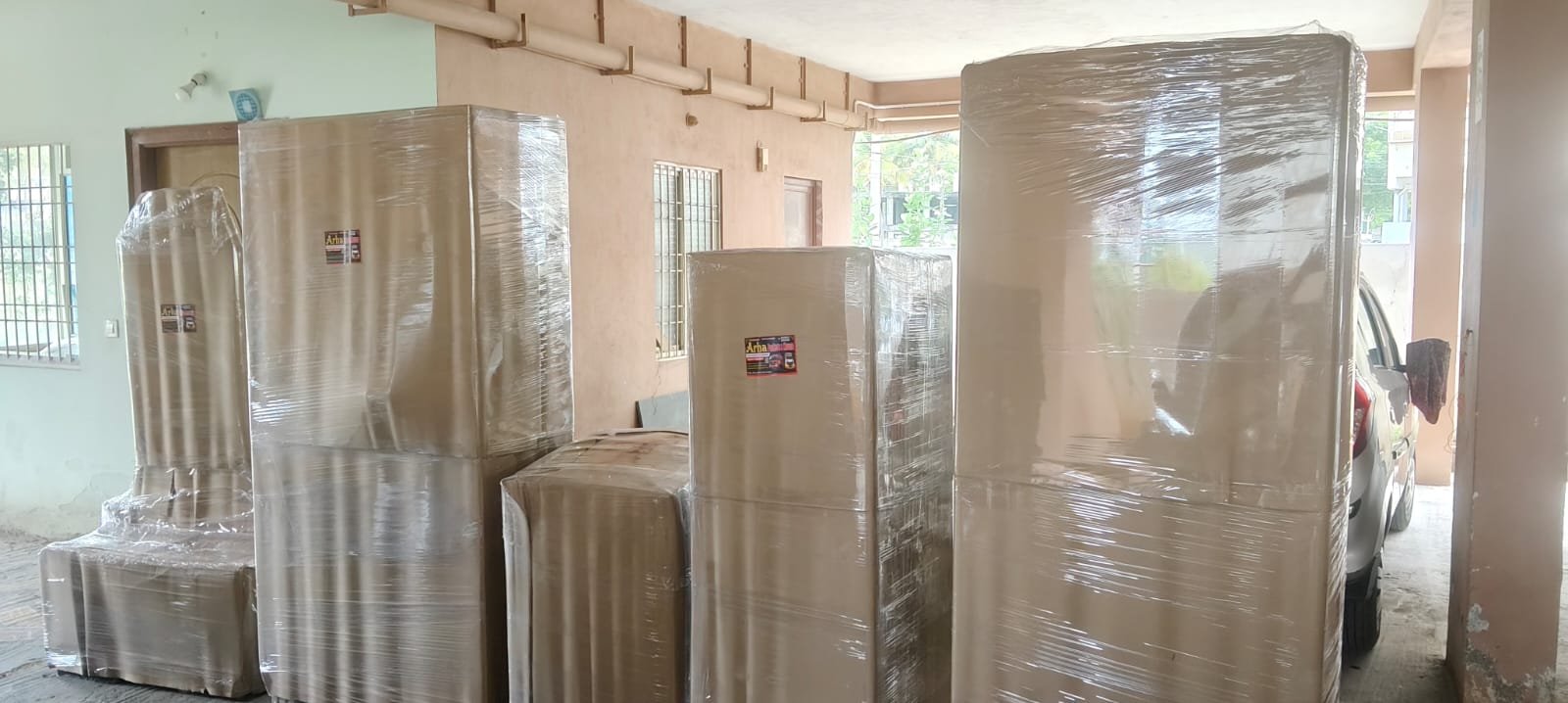 Wrapped furniture pieces arranged for shifting