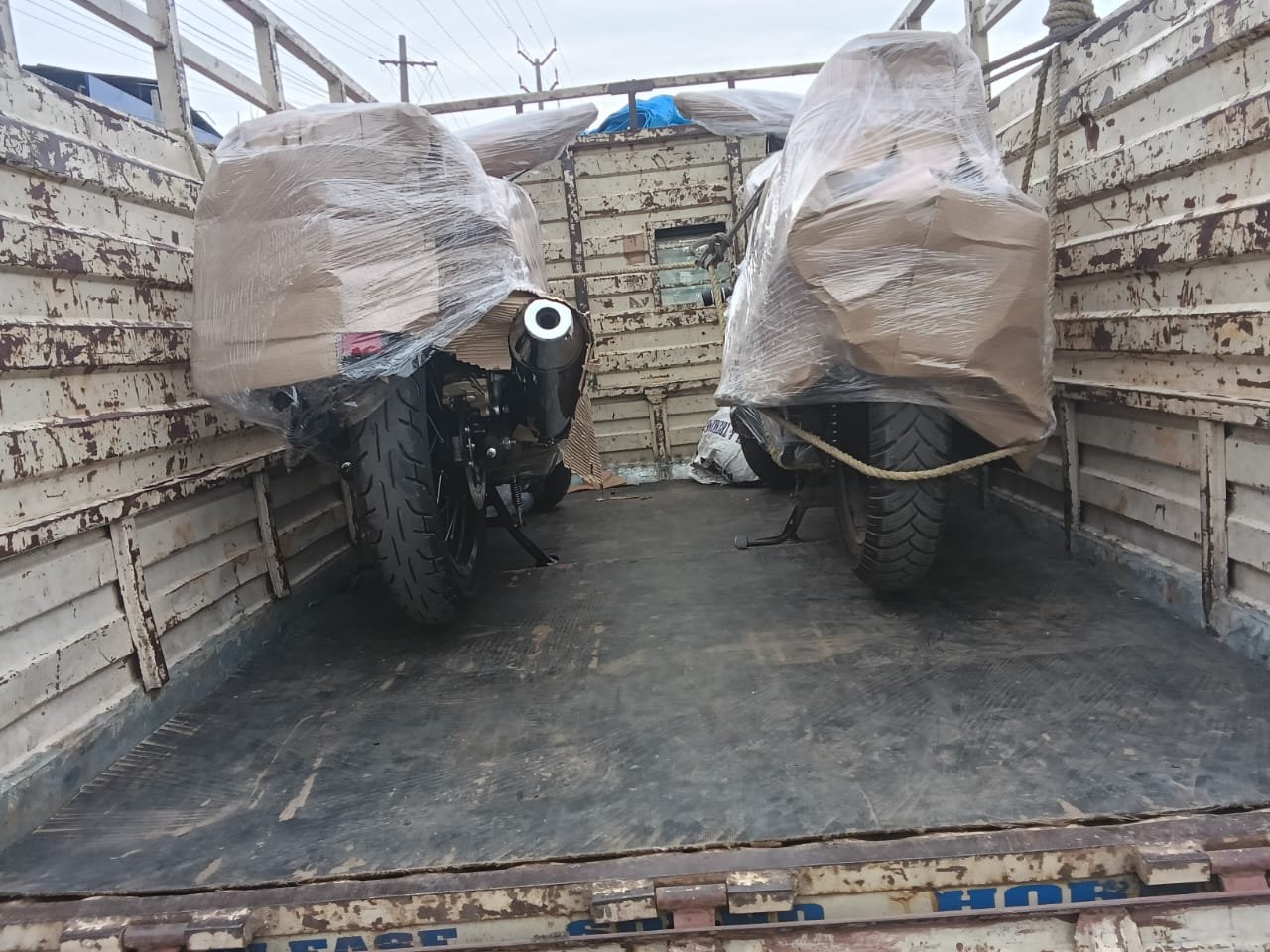Two bikes protected and loaded inside a transport vehicle